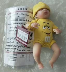 There's A Little Nut M & M Yellow Miniature Baby Doll  Ashto